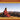 Sacred Mantras for Peace & Happiness book cover featuring a monk meditating in mountains