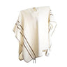 Cream colored woven poncho with brown stripe details