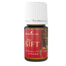 Young Living The Gift essential oil bottle with red label and white cap.