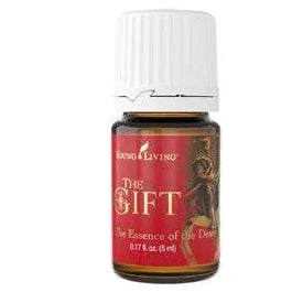 Young Living The Gift essential oil bottle with red label and white cap.