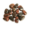 Polished red and black jasper tumbled stones for meditation and ritual.