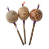 Three handcrafted shamanic rattles with carved animal designs and wooden handles.