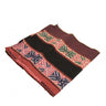 Handwoven ethnic patterned fabric pouch with red and black tribal motifs.