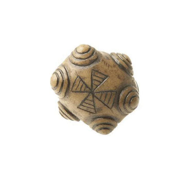 Hand-carved wooden shamanic rattle with geometric symbols and spiral designs