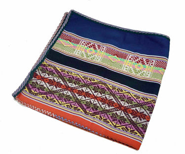 A folded square woven textile, likely a scarf or bandana, featuring a navy blue top section and a highly detailed, multicolored geometric patterned border with orange, green, red, yellow, and purple elements, set against a plain white background.
