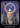 A tarot-style card titled 'AWARENESS' showing a hooded figure with a glowing yellow halo over the head against a cosmic purple and blue starry background. The card has a black border and the title 'AWARENESS' printed at the bottom.