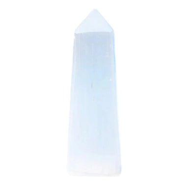 A natural white selenite crystal tower with a pointed tip, standing upright against a solid light blue background.
