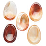 Five smooth, polished oval cabochon gemstones in various colors and patterns, including amber, reddish-brown, peach, and cream, arranged on a plain white background.