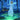 Book cover for 'Korrigan: Guardian of the Sacred' featuring an illustration of a glowing fairy in a white gown standing in a mystical blue forest with green ground and small golden lights.