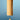 A wooden wind chime with a cylindrical body and a teardrop-shaped striker, suspended by black cords against a blue gradient background.