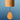 A bamboo wind chime with a teardrop-shaped wooden striker hanging from a dark cord, set against a blue gradient background.
