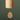 A close-up of a wooden wind chime hanging against a dark green background. The cylindrical top section is light natural wood with the brand name 'Kashi' printed on it, and a teardrop-shaped wooden striker hangs below with a small gold-toned accent.