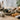 Smudging ritual set with smoking sage bundle, palo santo sticks, feathers, and crystals.