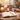 Spiritual ritual altar with lit candles, amethyst crystals, tarot cards, and incense smoke.