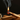 Burning palo santo wood stick with rising smoke for ritual cleansing and smudging.