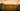 Large iridescent bubble floating over a prehistoric stone circle at sunset in a grassy field.