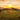 Large iridescent bubble floating over a prehistoric stone circle at sunset in a grassy field.
