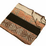 A folded woven blanket with a geometric pattern in beige, brown, and terracotta, featuring a wide black stripe across the center, shown on a plain white background.