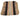 A flat-laid woven textile, likely a traditional blanket, rug, or garment panel, featuring vertical stripes of black, tan, beige, pink, and light green with geometric diamond patterns.
