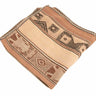 A folded woven textile with a Southwestern geometric pattern in shades of tan, beige, and brown, isolated on a white background.