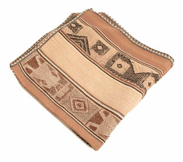A folded woven textile with a Southwestern geometric pattern in shades of tan, beige, and brown, isolated on a white background.