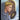 A tarot card titled 'INTUITION' with the number 2 at the top. The card art shows a blonde woman in profile wearing a blue-gray hooded robe and a silver cross necklace, looking toward a glowing circular object in the foreground, with a golden arched door and bright light behind her.