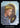 A tarot card titled 'INTUITION' with the number 2 at the top. The card art shows a blonde woman in profile wearing a blue-gray hooded robe and a silver cross necklace, looking toward a glowing circular object in the foreground, with a golden arched door and bright light behind her.