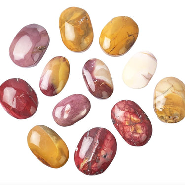 A group of polished, tumbled gemstone pendants in various colors including yellow, red, pink, and cream, arranged on a plain white background.