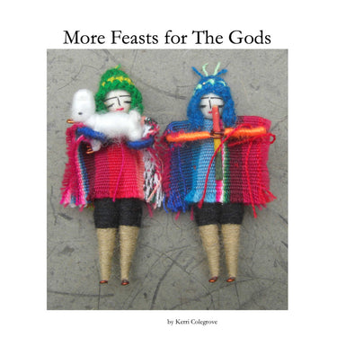 Two handcrafted textile dolls in colorful ritual clothing for altar decor.